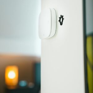 Home A sleek smart home light switch installed on a wall, showcasing modern technology in living spaces.